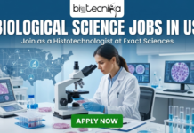Explore Biological Science Jobs in the US | Histotechnologist Position at Exact Sciences Biological Science Jobs in US Join as a Histotechnologist at Exact Sciences. A promotional banner with the Biotecnika Global logo at the top. Large white text reads "BIOLOGICAL SCIENCE JOBS IN US" with "Join as a Histotechnologist at Exact Sciences" below it. The background shows a woman in a lab coat examining samples with a microscope, surrounded by scientific equipment and a US map with icons. A green "APPLY NOW" button is at the bottom.