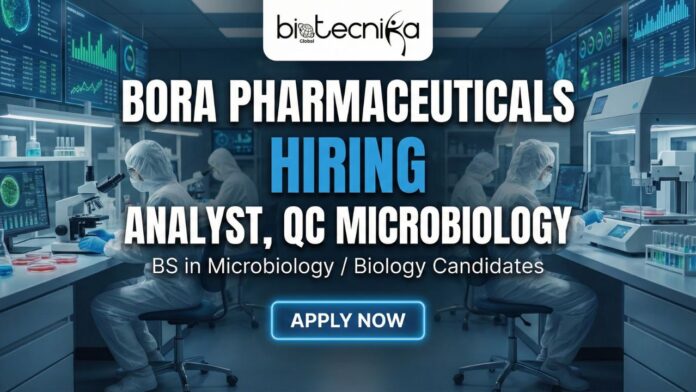 QC Microbiology Analyst performing environmental monitoring in a pharmaceutical lab