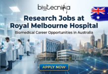 Research Jobs at Royal Melbourne Hospital | Biomedical Career Opportunities in Australia Research Jobs at Royal Melbourne Hospital Jobs in Australia. Featured image for Biotecnika Global, advertising "Research Jobs at Royal Melbourne Hospital" with "Biomedical Career Opportunities in Australia." The visual is a composite showing a modern research laboratory with scientists, an exterior view of the Royal Melbourne Hospital, and the Melbourne city skyline with a map of Australia. A prominent "APPLY NOW" button is at the bottom.