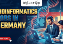 Bioinformatics Jobs in Germany | Explore Computational Biology Positions at DKFZ Bioinformatics Jobs in Germany Explore Computational Biology Positions at DKFZ. A promotional graphic by Biotecnika Global for "BIOINFORMATICS JOBS IN GERMANY". The left side features large, gold text with the title, followed by the subtitle "Unlock Your Career in Genomics & Data Science." and a red "APPLY NOW" button with a cursor icon. The right side shows a male and a female professional working on laptops amidst a background of a large DNA helix, data visualizations, a map of Germany, and the Berlin TV Tower.