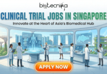 Clinical Trial Jobs in Singapore | Apply For Clinical Trial Manager Role at Medpace Clinical Trial Jobs in Singapore Apply For Clinical Trial Manager Role at Medpace. A promotional banner for Biotecnika Global titled "CLINICAL TRIAL JOBS IN SINGAPORE" with the subtitle "Innovate at the Heart of Asia’s Biomedical Hub." The illustration shows a diverse team of scientists in a futuristic laboratory with holographic displays, overlooking the Singapore skyline including Marina Bay Sands and Gardens by the Bay. At the bottom, there is a glowing orange button with the text "APPLY NOW."