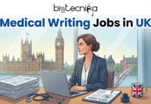 Explore Medical Writing Jobs in UK | Apply Now For Medical Writer Role at Engage XD Explore Medical Writing Jobs in UK Apply Now For Medical Writer Role at Engage XD. An engaging and professional featured image for "Medical Writing Jobs in UK" by Biotecnika Global, with the logo centered at the top. The illustration features a professional woman in a grey blazer working on a laptop at a desk overlooking the London skyline, with the Big Ben and Palace of Westminster clearly visible through a large window. Her desk is organized with a stack of research papers, a stethoscope, a "Medical Journal," an inkwell with a quill, and a mug featuring the Union Jack. The title is displayed in bold blue and black text at the top, creating a perfect blend of clinical expertise and professional writing within a British context.