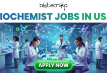 Latest Biochemist Jobs in USA | United Therapeutics Corporation Hiring Now Latest Biochemist Jobs in USA | United Therapeutics Hiring Now. A vibrant featured image titled "BIOCHEMIST JOBS IN USA" with the Biotecnika Global logo at the top center. The scene depicts a modern, high-tech laboratory where diverse biochemists in white lab coats and safety goggles are conducting research with colorful chemicals and digital displays. A glowing blue map of the United States with interconnected nodes serves as the background, and a prominent green "APPLY NOW" button is positioned at the bottom center.