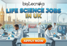 Life Science Jobs in the UK | Junior Scientific Advisor at Boehringer Ingelheim Life Science Jobs at Boehringer Ingelheim UK | Apply Now. A featured image for Biotecnika Global titled "LIFE SCIENCE JOBS IN UK" in large, stylized blue and gold text. The illustration depicts a diverse group of scientists in lab coats working with microscopes and high-tech equipment in a modern laboratory. Large windows in the background offer a panoramic view of London landmarks, including Big Ben, the Houses of Parliament, the London Eye, and a red double-decker bus. A glowing orange button with the text "APPLY NOW" is centered at the bottom of the image.