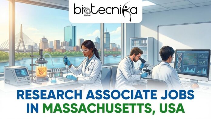 An image featuring the Biotecnika Global logo at the top center. The scene depicts a modern, high-tech laboratory where diverse scientists—two women and two men—are engaged in biological research. In the foreground, two researchers are using microscopes and pipettes at a lab bench filled with colorful test tubes and petri dishes. Through a large window in the background, iconic American landmarks like the Statue of Liberty and the Golden Gate Bridge are visible, alongside a digital map of the USA and a DNA double helix. A small American flag sits on the workbench. At the bottom, the bold text reads 