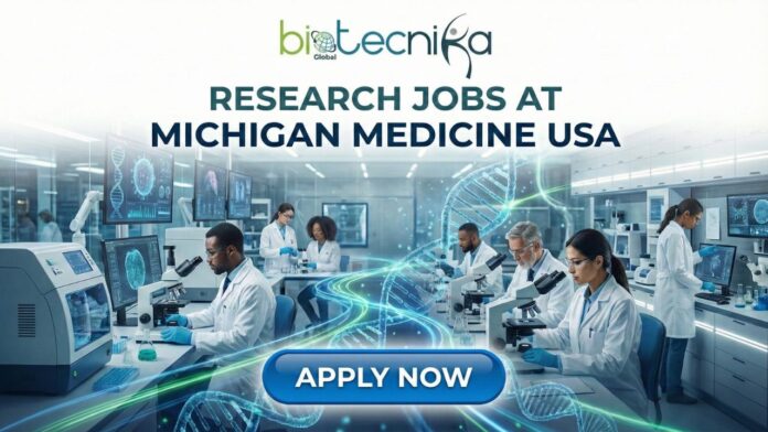 Laboratory technician working in a research lab at Michigan Medicine with cell cultures and molecular assays