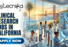 Clinical Research Jobs in California | Latest Job Opening in USA Clinical Research Jobs in California Latest Job Opening in USA. A featured image for job listings, titled "CLINICAL RESEARCH JOBS IN CALIFORNIA" in large, bold text on the left, positioned below the "biotecnika Global" logo. A glowing blue "APPLY NOW" button is located at the bottom left. The illustration on the right shows a diverse team of clinical researchers and healthcare professionals wearing lab coats and scrubs in a modern, futuristic facility. They are interacting with holographic displays showing medical data and maps of California, with patients present. The background features expansive windows overlooking a sunset view of the Golden Gate Bridge and palm trees.