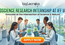 Bioscience Research Internship at IFF USA | Apply For Summer R&D Internship Today Bioscience Research Internship at IFF USA. A promotional banner for a "BIOSCIENCE RESEARCH INTERNSHIP AT IFF USA" by "Biotecnika Global". The title is in large green text, with the subtitle "Innovate at the Intersection of Science & Nature" below it. The illustration shows a diverse group of six young scientists in a modern, sunlit laboratory, working with microscopes, tablets displaying data, and bioreactors containing green plants. In the background, through large windows, is a bright cityscape with an American flag. At the bottom is a large orange "APPLY NOW" button.