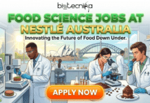 Food Science Jobs at Nestlé | Latest Career Opportunities in Australia Food Science Jobs at Nestlé Latest Career Opportunities in Australia. A promotional banner for Biotecnika Global titled "FOOD SCIENCE JOBS AT NESTLÉ AUSTRALIA" with the subtitle "Innovating the Future of Food Down Under." The illustration shows three scientists in a modern laboratory testing food products, including a plant-based burger, coffee beans under a microscope, and chocolate cake. Large windows in the background offer a view of the Sydney Opera House and Harbour Bridge under a sunny sky. A prominent orange "APPLY NOW" button is centered at the bottom.