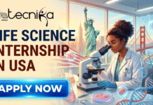 Life Science Internship in US | Johnson & Johnson Is Hiring Today Life Science Internship in US Johnson & Johnson Is Hiring Today. A high-quality featured image for a job posting titled "Life Science Internship in USA." The image features a professional female scientist focused on her work at a microscope in a bright, modern laboratory. Through a large window in the background, iconic American landmarks—including the Statue of Liberty, the Golden Gate Bridge, and the Empire State Building—are visible against a sunrise sky. The Biotecnika Global logo is placed at the top left, and a vibrant blue "Apply Now" button is positioned at the bottom. The scene is enhanced with scientific elements like floating DNA strands and petri dishes.