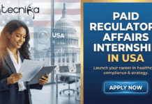 Paid Regulatory Affairs Internship in USA | Beckman Coulter Hiring Now Paid Regulatory Affairs Internship in USA Beckman Coulter Hiring Now. A professional promotional image for a Paid Regulatory Affairs Internship in USA. On the left, a smiling professional woman in a business suit holds a document and a tablet. The background features the US Capitol building and a faint American flag, with digital overlays showing a compliance checklist and the "USA" label. The right side features a deep blue background with a gold border. At the top is the Biotecnika Global logo, followed by bold, gold and white text that reads "PAID REGULATORY AFFAIRS INTERNSHIP IN USA" and the tagline "Launch your career in healthcare compliance & strategy." At the bottom right, there is a prominent, glowing "APPLY NOW" button.