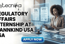 Regulatory Affairs Internship in USA | Biotech Career at MannKind Regulatory Affairs Internship in USA Biotech Career at MannKind. A featured image for a job advertisement titled "REGULATORY AFFAIRS INTERNSHIP AT MANNKIND USA USA" in bold black text. The illustration depicts a professional woman sitting at a modern desk, interacting with a tablet. Glowing holographic displays float before her, showing "FDA GUIDELINES" and "APPROVAL PROCESS" documents. On the desk, a legal gavel and stacks of regulatory books emphasize the nature of the role. The background features large windows with a view of the US Capitol building and a city skyline. The Biotecnika Global logo is positioned at the top left, and a bright blue "Apply Now" button is at the bottom center.