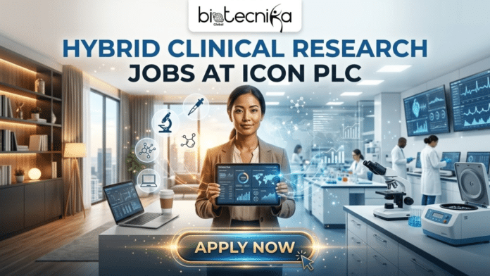 Clinical Research Jobs ICON plc Hybrid Job Opportunity. A job advertisement image from Biotecnika Global with the headline: 'HYBRID CLINICAL RESEARCH JOBS AT ICON PLC'. The central figure is a woman professional holding a data tablet, positioned between two merged environments. The left side shows a modern home office with a laptop and a city view, and the right side depicts a high-tech clinical research lab with scientists working and equipment like microscopes. Floating icons for a microscope, pipette, molecule, and laptop surround the woman, illustrating the job's blend of at-home and in-lab duties. At the bottom, a glowing button reads 'APPLY NOW' with a mouse cursor over it.