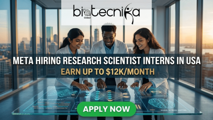 Dream Internship Alert Meta Hiring Research Scientist Interns in USA Earn Up to $12KMonth. An advertisement from biotecnika Global with the main headline: 'META HIRING RESEARCH SCIENTIST INTERNS IN USA' and the tagline: 'EARN UP TO $12K/MONTH'. The visual scene shows three diverse, smiling researchers—an Indian woman, a Black man, and a Latina woman—in white lab coats collaborating at a large, futuristic, transparent touchscreen table. The table displays intricate, glowing blue schematics of neural networks, genetic sequences, AI model optimization data, and a brain with 'NEURAL NETWORK MAPPING' text. The setting is a modern, glass-walled high-rise office with a stunning golden hour sunset over an American city skyline in the background. At the bottom center, a prominent green button reads: 'APPLY NOW'.