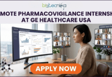 Remote Pharmacovigilance Internship at GE HealthCare – Break Into Drug Safety Careers in USA! Remote Pharmacovigilance Internship at GE HealthCare – Break Into Drug Safety Careers in USA! A promotional banner for Biotecnika Global, with its logo (text and globe icon) at the top. The headline text states: 'REMOTE PHARMACOVIGILANCE INTERNSHIP AT GE HEALTHCARE USA'. The central part of the image features a professional young woman with short dark hair, sitting at a wooden desk in a modern home office with a large window showing a city view. She is wearing a textured beige sweater and is looking intently at a curved ultra-wide monitor. The monitor displays sophisticated data dashboards with charts and graphs, including labels like 'GLOBAL DRUG SAFETY INTELLIGENCE', 'Adverse Event Reports', 'Safety Signal Detection', and 'Case Analysis'. Text on the screen also mentions 'Intern Portal: Accessing PV Data'. Floating to the right of the monitor is a video call grid labeled 'Global Team Sync', showing multiple diverse faces of team members. On the left of the desk is a physical molecular model structure. At the bottom of the image, a large, prominent orange button with bold white text reads 'APPLY NOW'. The overall color scheme is calm and professional with deep purples and oranges. The background shows blurred houseplants and a modern mug.