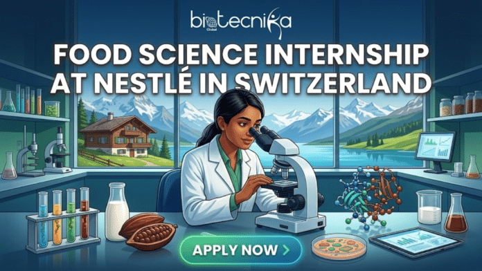 Food Science & Biology Students Nestlé Hiring Food Science Interns in Switzerland – Apply Now! A promotional featured image for a job page advertising a Food Science Internship at Nestlé in Switzerland, with the biotecnika Global logo at the top. The image depicts a diverse woman researcher in a lab coat sitting at a modern lab bench, intensely looking through a microscope. The bench is set with test tubes, cocoa pods, milk, and a molecule model. Through a large window behind her, a breathtaking panoramic view of the snow-capped Swiss Alps, a classic Swiss chalet, and an alpine lake is visible, establishing the location. The image is an attractive, scroll-stopping digital illustration. A prominent, glowing