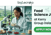 Food Science Job at Kerry Group Ireland | Life Science & Food Science Apply Now Food Science Job at Kerry Group Ireland Life Science & Food Science Apply Now. A split-layout featured image. The left side features a photo of a female food scientist in a white lab coat and gloves, carefully using a micropipette to dispense liquid into a petri dish filled with berries and what appears to be cheese, with a microscope and other food samples (oats, cheese wheels) on her bench. Through a large window behind her is a view of rolling green Irish hills and a research/production facility. At the top of the image is the 'biotecnika Global' logo. The right side has a light green background with the text: "Food Science Job" in large font, followed by "at Kerry Group Ireland" and small icons of molecules and wheat stalks. Below this, a large green pill-shaped button with white text reads "APPLY NOW".