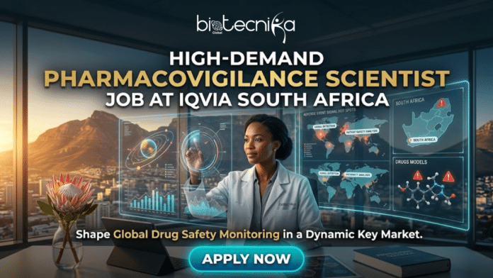 High-Demand Scientist Job in South Africa – Become a Pharmacovigilance Expert with IQVIA!. A promotional banner for a high-demand pharmacovigilance scientist job at IQVIA South Africa. An African woman scientist in a biotechnika lab coat is using gesture controls on a transparent digital display that shows global adverse event maps and drug data analytics. Above her, text reads