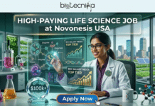 High-Paying Life Science Job at Novonesis USA | Apply Before 13th April 2026! High-Paying Life Science Job at Novonesis USA Apply Before 13th April 2026! An illustrated job advertisement for a high-paying life science role at Novonesis USA, featured by Biotecnika Global. A smiling woman of South Asian descent in a lab coat and glasses gestures toward transparent interactive screens displaying cellular diagrams labeled with terms like 'Enzyme' and charts titled 'BIO-SALARY INDEX: TOP TIER' with rising bar and line graphs and a DNA helix. Below the screens, a prominent crystal award is marked '$100k+.' Prop flasks with colorful liquids, molecule models, and a 'Biotecnika' mug rest on the desk. The background is a modern laboratory office with a city skyline and vertical farms seen through a large window. The main title 'HIGH-PAYING LIFE SCIENCE JOB at Novonesis USA' is centered within a glass frame. The top logo is 'Biotecnika Global.' A large 'Apply Now' button with a mouse cursor is at the bottom.