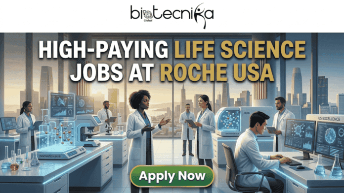 High-Paying Life Science Jobs at Roche USA You Shouldn’t Miss!. A featured image banner from biotecnika Global with the headline 'HIGH-PAYING LIFE SCIENCE JOBS AT ROCHE USA' in bold gold and white letters. The image depicts a modern, futuristic Innovation HUB life science laboratory with diverse scientists in white lab coats interacting with high-tech equipment, including holographic displays of molecular structures and computer workstations. Through a large window, a vast city skyline is visible with the American flag, suggesting a major US city hub. At the bottom center, a prominent green button reads 'Apply Now'.