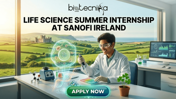 Latest Life Science Summer Internship at Sanofi in Ireland! A detailed promotional banner for the Biotecnika Global 'Life Science Summer Internship at Sanofi Ireland'. The image features a smiling young male scientist in a lab coat and safety glasses using a pipette at a modern lab bench. Centered is a large, detailed green-glowing hologram of a cell with a stylized shamrock nucleus and a DNA helix at its base. The background is a large window with a beautiful view of an Irish castle and rolling green hills. Below the scene, a glowing green button reads 'APPLY NOW'. The text 'biotecnika Global' is at the very top, and the internship title is in large text just below it.