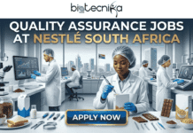 Quality Assurance Job for Life Science Graduates at Nestlé South Africa | Apply Today!! Quality Assurance Jobs for Life Science Graduates at Nestlé South Africa Apply Today!! A detailed promotional banner image for "Quality Assurance Jobs at Nestlé South Africa" by biotecnika Global. The image shows a modern quality assurance laboratory with four scientists in white lab coats and hairnets working. The central scientist, a Black South African woman, uses a measurement tool on an unbranded cereal product, while others interact with a microscope, computer screens displaying data and graphs, and intricate unbranded sensory analysis terminals. Samples of unbranded cereal (e.g., in a bowl and box) and milk (e.g., a carton and bottle) are arranged in the foreground. Through a massive, clean window, a clear view of a modern South African cityscape under a clear sky with a South African flag is visible. The top headline in white and gold text reads: "QUALITY ASSURANCE JOBS AT NESTLÉ SOUTH AFRICA". At the bottom center, a prominent button with gold and blue gradients reads "APPLY NOW". Below the button, a small tagline reads "JOIN THE SOUTH AFRICAN INNOVATION TEAM". The biotecnika Global logo is prominent at the top of the image. Precision equipment and samples create a theme of safety, accuracy, and innovation. The entire composition has a premium finish. No company logo for Nestlé is included.