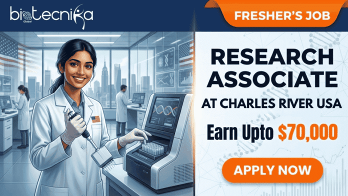 Research Associate Job at Charles River USA Fresher's Job. A split featured image job posting graphic. The top header features the 'biotecnika Global' logo on the left and an orange 'FRESHER’S JOB' banner on the right. The left panel is a photograph of a smiling young South Asian woman scientist in a white lab coat with safety glasses, using a multichannel pipette, in a modern, glass-walled laboratory with other scientists and a USA flag pin on her lapel, and a view of a US city skyline. In the foreground is a DNA analysis machine with a screen showing a DNA double helix and a graph. The right panel contains bold text: 'RESEARCH ASSOCIATE', 'at Charles River USA', 'Earn Upto $70,000', with a large orange 'APPLY NOW' button below. The right background has subtle molecular patterns.