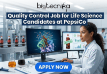 Urgent Hiring: Quality Control Job for Life Science Candidates in South Africa at PepsiCo Urgent Hiring Quality Control Job for Life Science Candidates in South Africa at PepsiCo. A detailed promotional photo-composite graphic with the "biotecnika Global" logo at the top and the bold headline, "Quality Control Job for Life Science Candidates at PepsiCo." The image features a photograph of an Indian female scientist in a lab coat at a workstation, looking intently at computer screens. The main left monitor displays a complex, colorful protein structure visualization labeled with scientific text like "Flavor Profile Verification," "Flavor Stability Analysis," "Taste Receptor," and "Caffeine Level Check." The right monitor shows a photo of a brown soda bottle with a green "QC PASS" stamp and pass/fail charts. Beakers with colorful liquids, a pipette, and a data tablet are on the desk. The background is a detailed modern laboratory and a blurred automated factory conveyor belt moving soda bottles. A prominent blue button with the text "APPLY NOW" is at the bottom center.