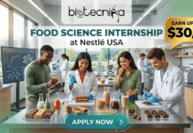 Food Science Internship at Nestlé USA | Launch Your Global Career & Earn Upto $30/hr! Food Science Internship at Nestlé USA | Launch Your Global Career & Earn Upto $30/hr! An illustrated photograph showing a modern, well-equipped food science research and development laboratory, with a diverse group of four scientists gathered around a central table covered in food samples and scientific equipment. From left to right: a man with short, curly dark hair is taking notes on a clipboard and observing; a woman with short, curly dark hair and glasses uses a pipette to apply a liquid to a multi-layered cake-like structure, smiling; a woman with long, dark hair tastes a drink from a glass with a pleased expression; and a man with short brown hair is adjusting small chocolate candies. The central workspace is filled with beakers containing colorful grains, liquids, and various prepared food items like stacks of gourmet bars, glasses of drinks (such as protein shakes), and rows of chocolates. The high-tech background features large windows looking out onto a modern campus, multiple computer monitors showing graphs, other scientific machinery, and blurred figures of additional lab staff working. A top banner contains the Biotecnika Global logo on the left and text in the center that reads "FOOD SCIENCE INTERNSHIP at Nestlé USA." At the top right, a gold speech bubble reads "EARN UPTO $30/hr". At the bottom center, a teal button with an arrow says "APPLY NOW". The overall color palette is composed of fresh greens, natural wood tones, and cool metal.